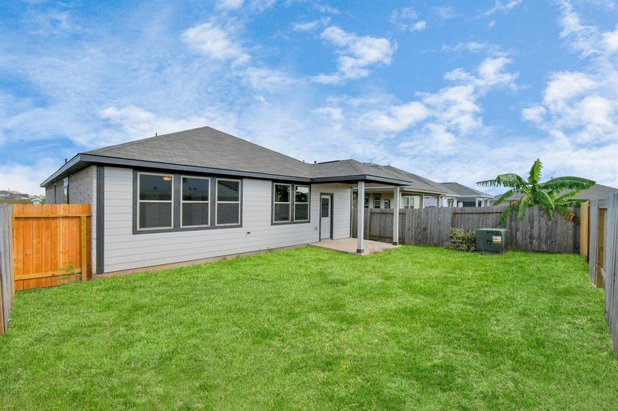 This outdoor area is the perfect canvas for your dream living space, featuring ample room for patio furniture, a BBQ pit, and limitless opportunities to design your own personal oasis.