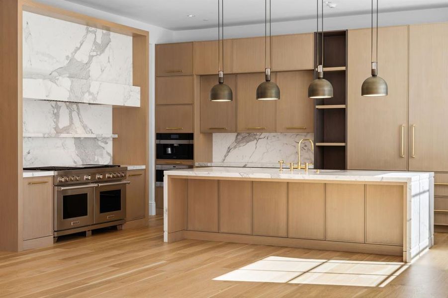 Kitchen with Wood Mode cabinetry and Calcutta Marble