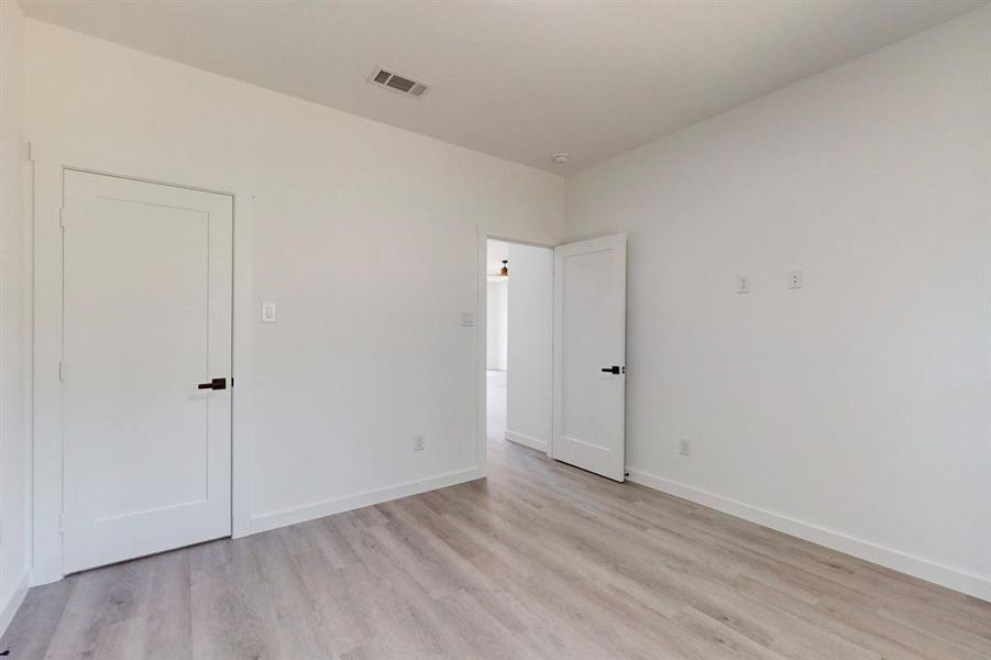 Empty room with light wood-type flooring