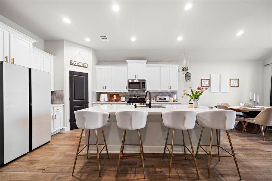 welcoming kitchen with an expansive island