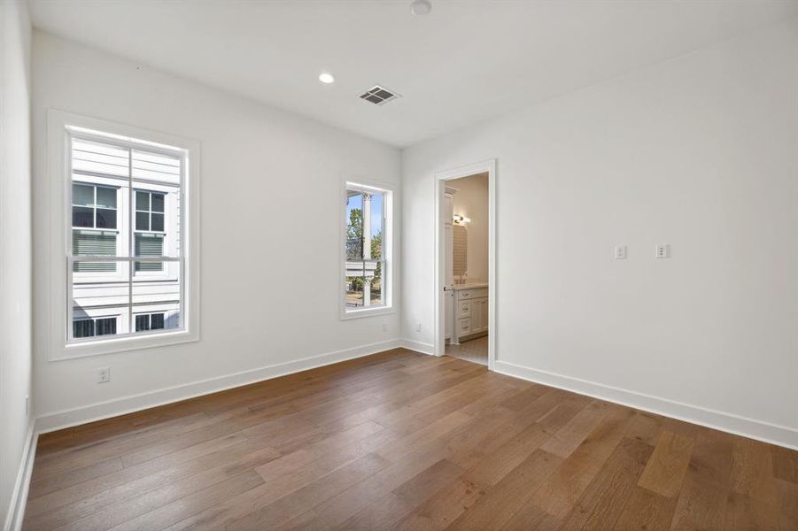 One of 3 upstairs secondary bedrooms each with fantastic closet, private ensuite bath and engineered white oak hardwood floors.