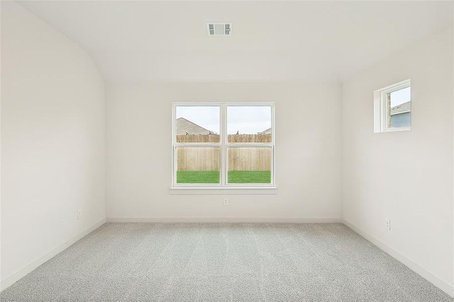 Spare room featuring carpet flooring