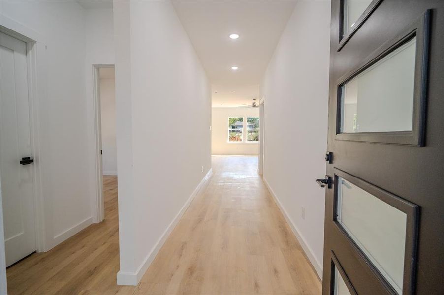 Hall featuring light wood-type flooring