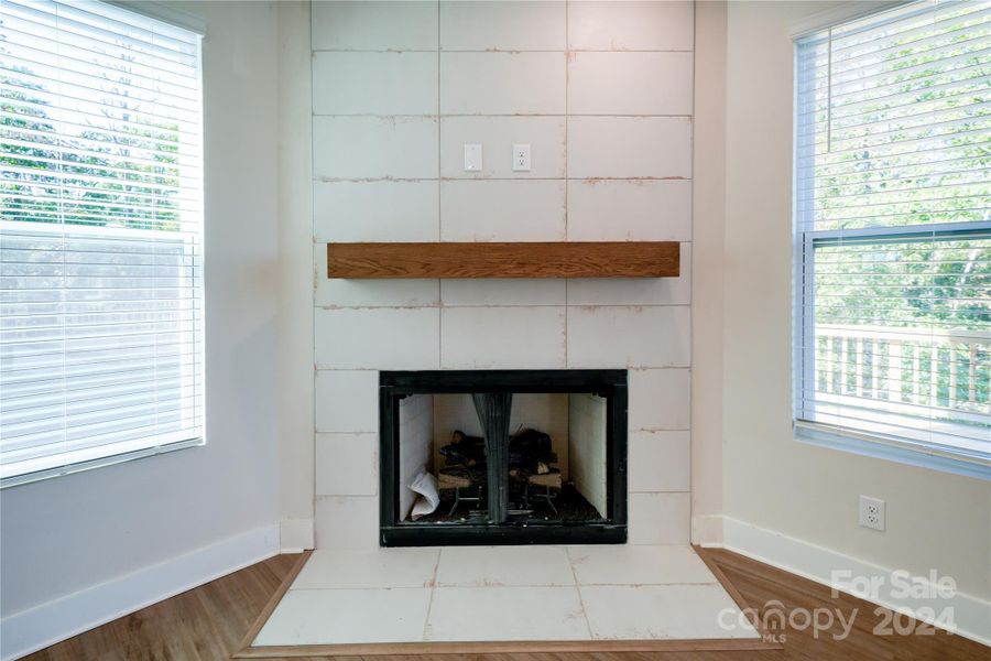 Ceramic Tile Fireplace with oak beam mantel