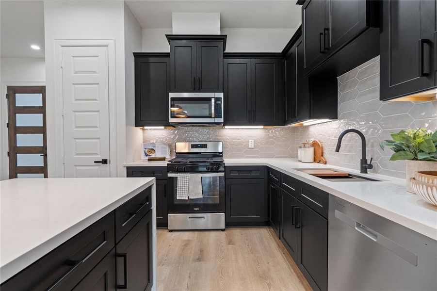 Experience modern convenience in this newly appointed kitchen, boasting brand-new stainless steel appliances that elevate your culinary experience.