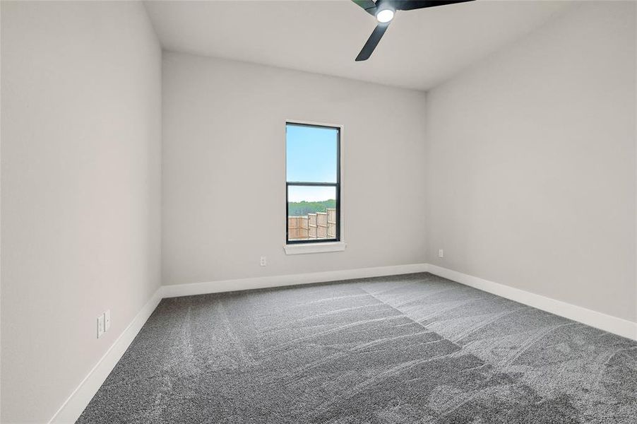 Second bedroom with ceiling fan