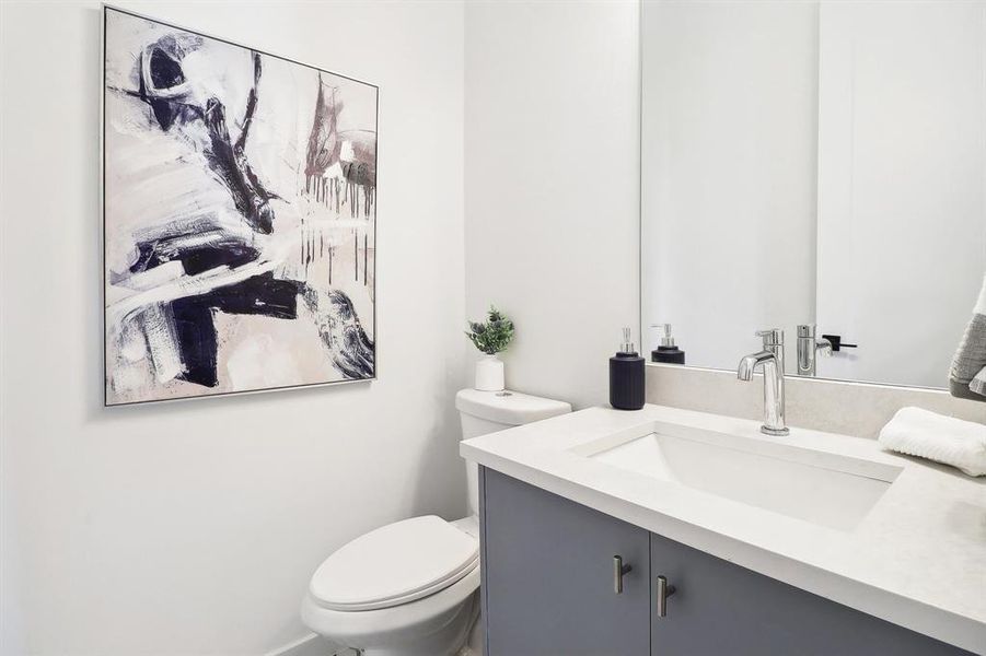 Bathroom with vanity and toilet