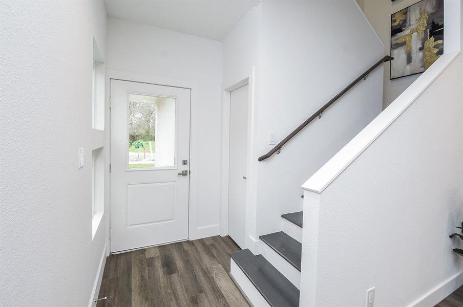 Great natural light warms the front entry/foyer.