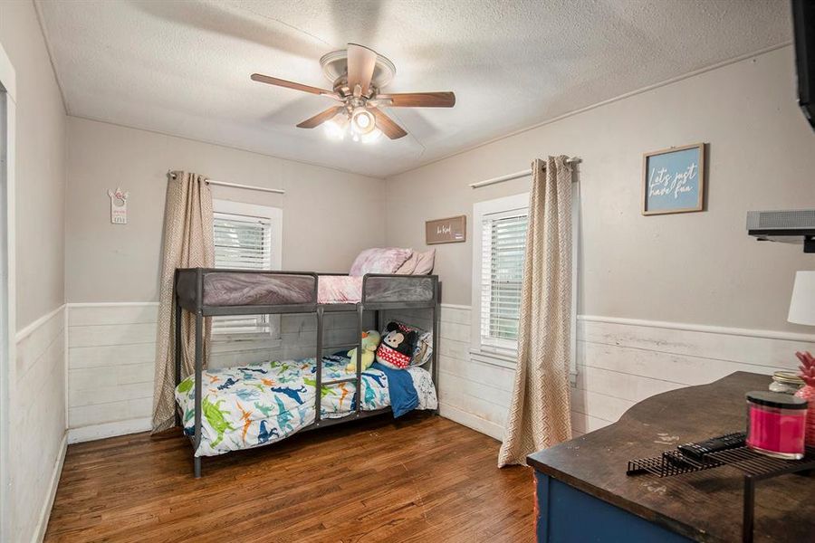 Bedroom at the back with hard wood floors