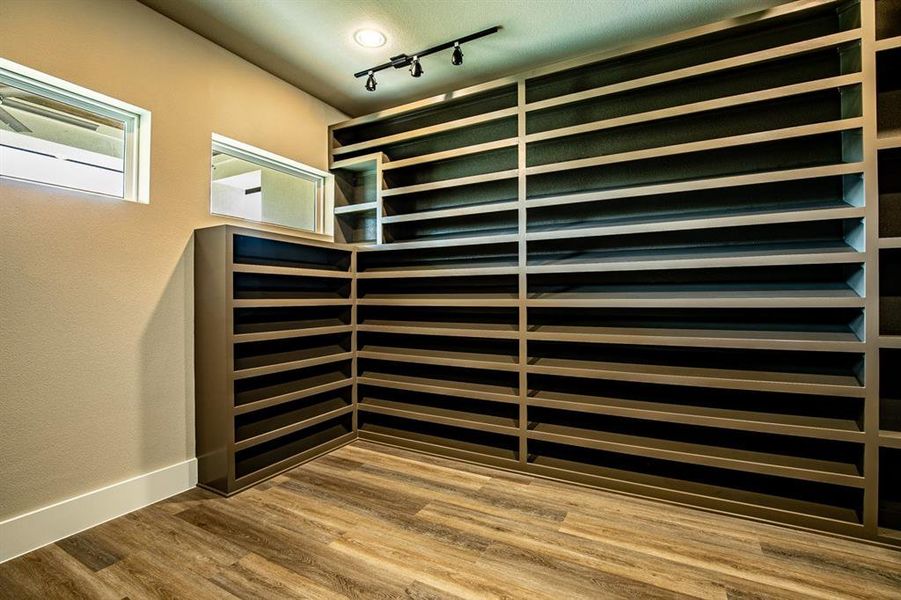 Closet #2 in primary bedroom with lots of shoe storage.. if you love shoes! This is for you.