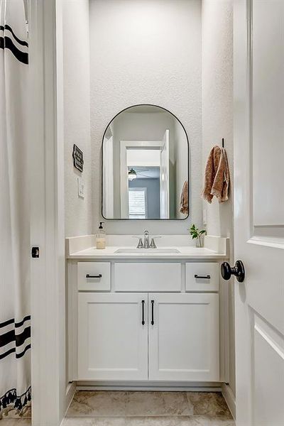 Guests will love the full bathroom adjacent to the guest room wit a high end vanity and stylish mirror.