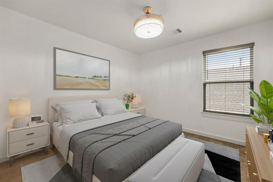 Secondary bedroom features plush carpet, neutral paint, custom lighting and a large window with privacy blinds.