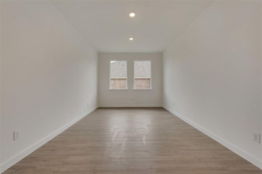 Spare room with light hardwood / wood-style floors