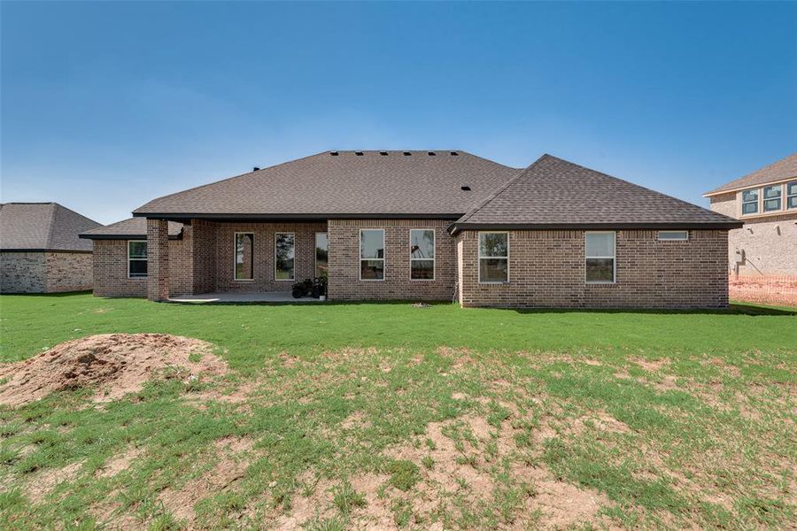 Back of property with a patio and a yard