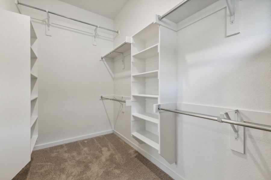 Primary Closet in the Pecan home plan by Trophy Signature Homes – REPRESENTATIVE PHOTO