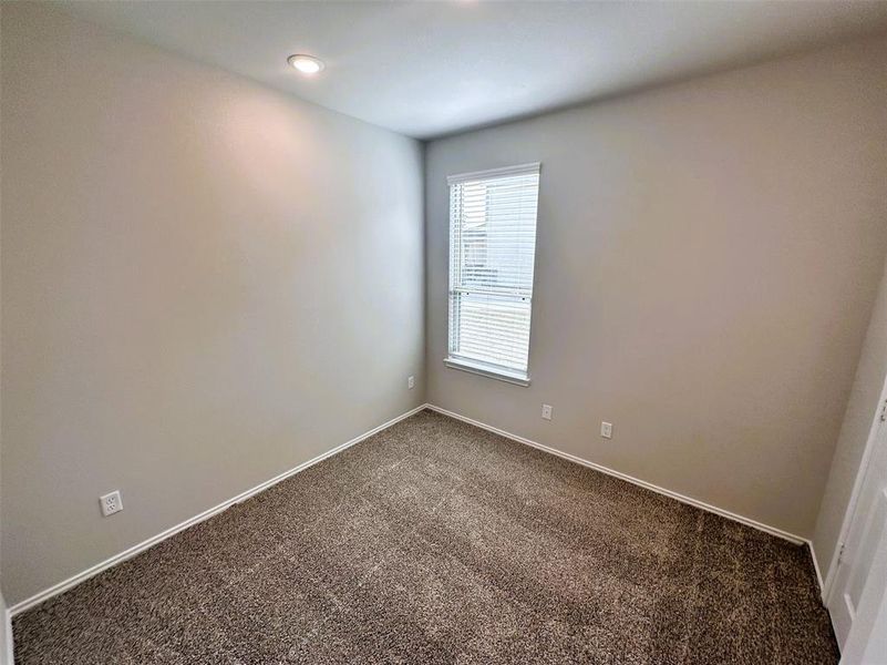 Bedroom 2 is cozy with plenty of natural light!