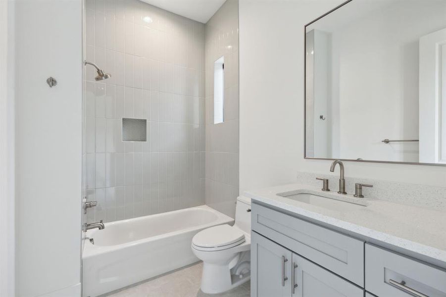 Full bathroom featuring bathtub and vanity