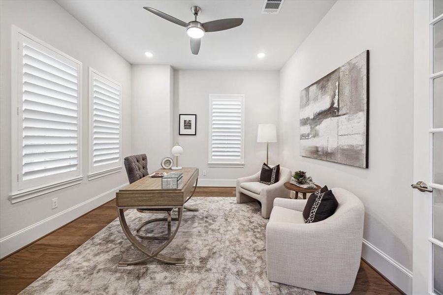 Elevate your work-from-home experience in this thoughtfully designed study, complete with tranquil views of the surrounding greenery, offering a sanctuary where you can unleash your creativity and productivity. Plantation shutters were newly installed.