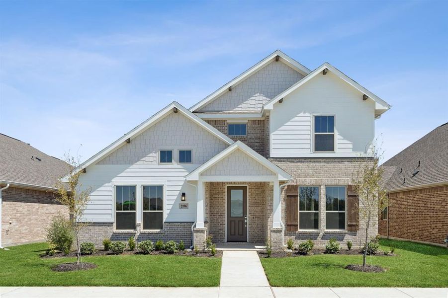 Craftsman-style home featuring a front yard