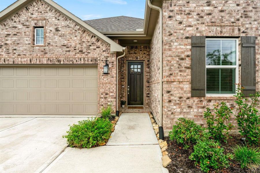 Inviting entry and beautiful brick elevation.