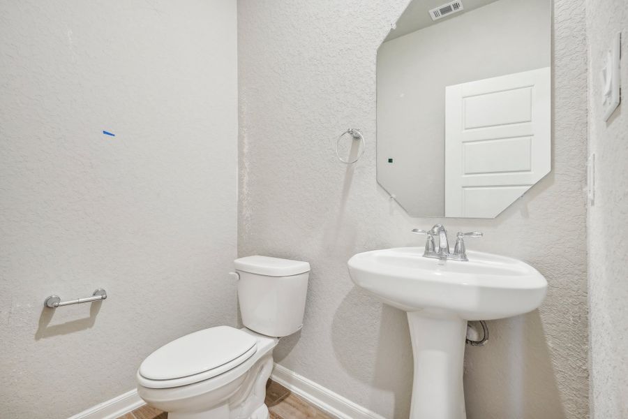 Powder room in the Fitzhugh floorplan at a Meritage homes community.