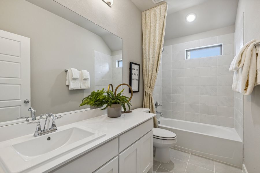 Bathroom in the Wimbledon home plan by Trophy Signature Homes – REPRESENTATIVE PHOTO