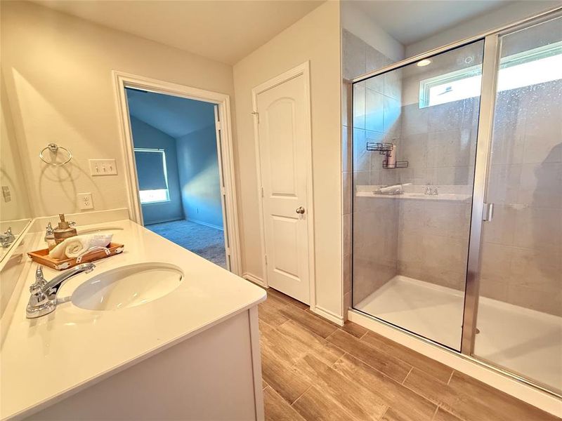 Bathroom featuring vanity and walk in shower