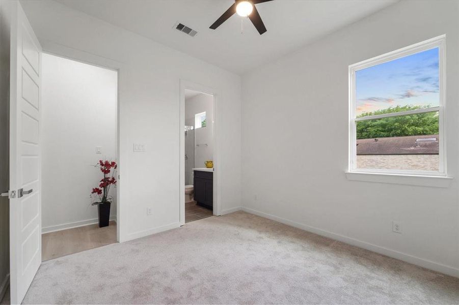 Bedroom 2 with designated Full bath, walk in closet.