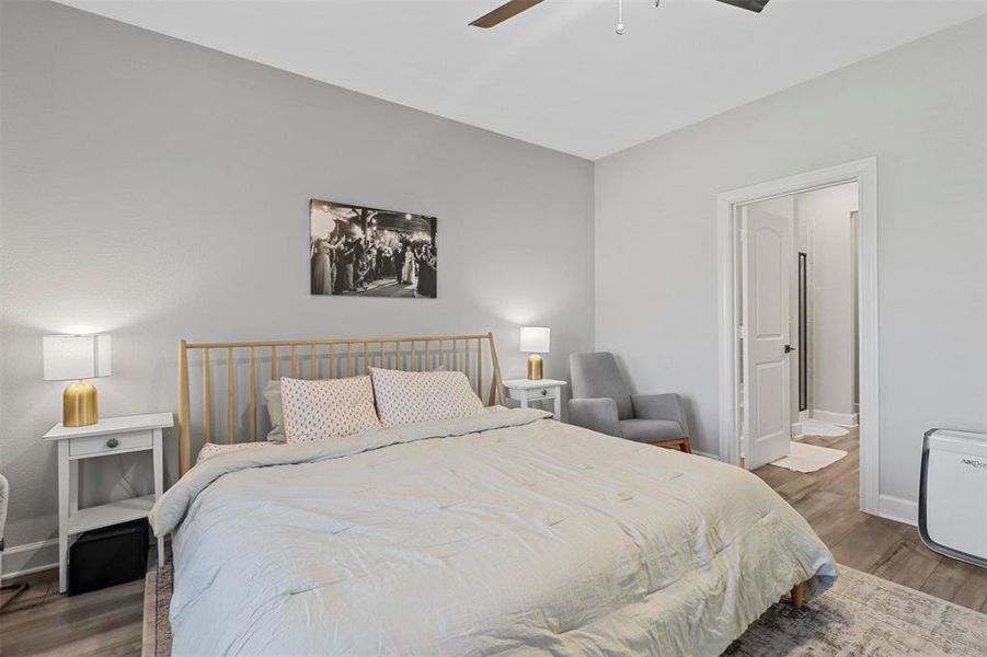 Bedroom with wood-type flooring and ceiling fan