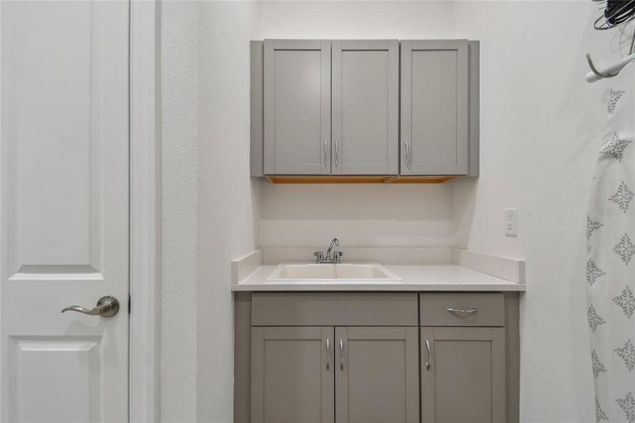 Laundry with built in cabinetry