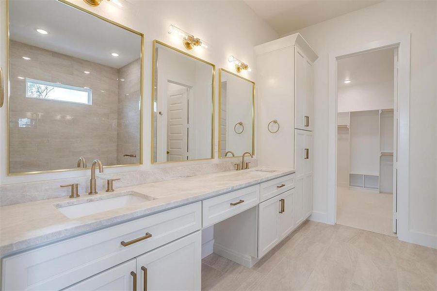 Bathroom featuring dual vanity and tile patterned flooring