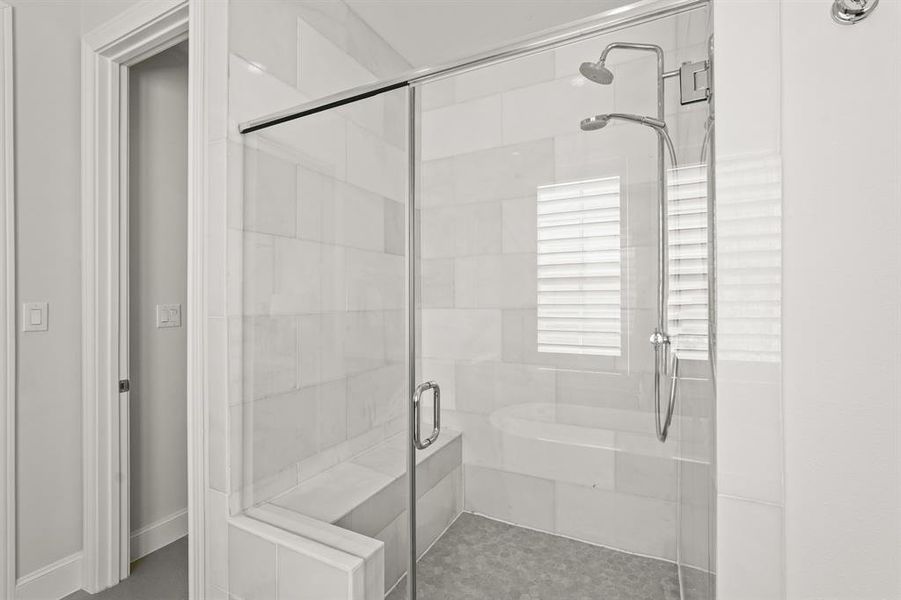 This beautiful Primary Bathroom features a gorgeous tiled walk-in shower.