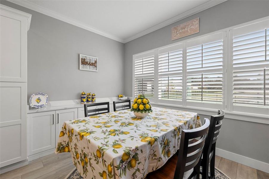 Breakfast Room Features a Built-in Buffet Cabinet with Quartz Countertop for Extra Storage