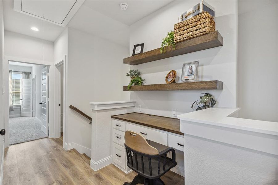 Home office featuring light hardwood / wood-style floors