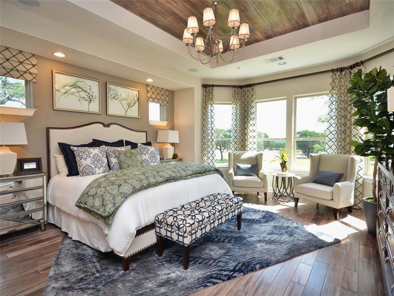 Primary Bedroom with Bay Windows to retreat and relax!