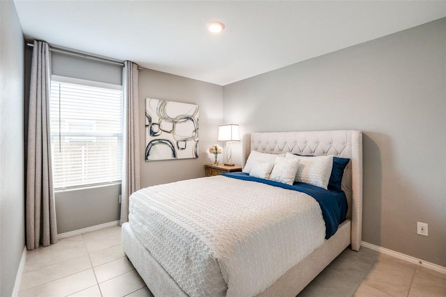 Bedroom 2 has a custom built in closet with drawers.