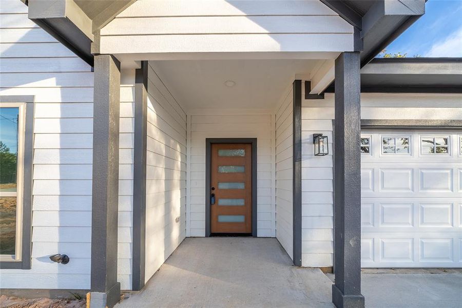 Entrance to property with a garage