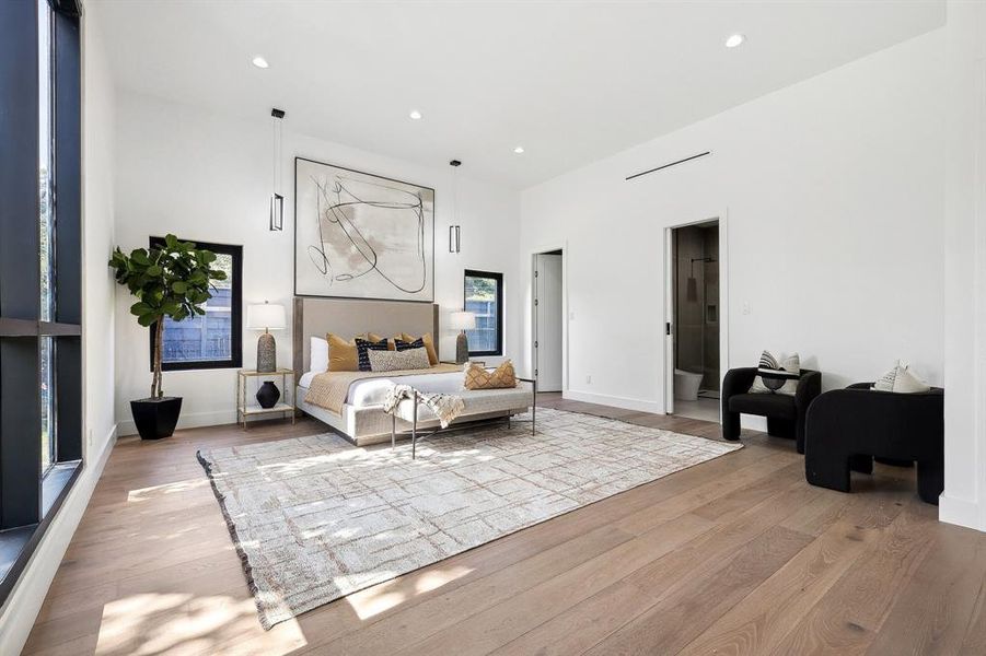 This secondary bedroom is large enough to be a second primary bedroom. Large window, custom closet and ensuite full bath.