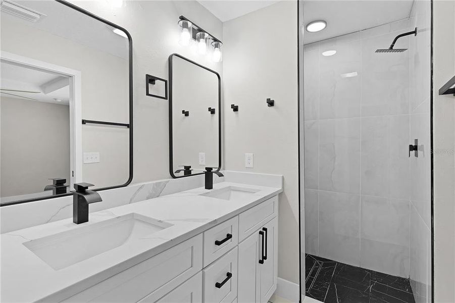Primary bathroom double sink with shower