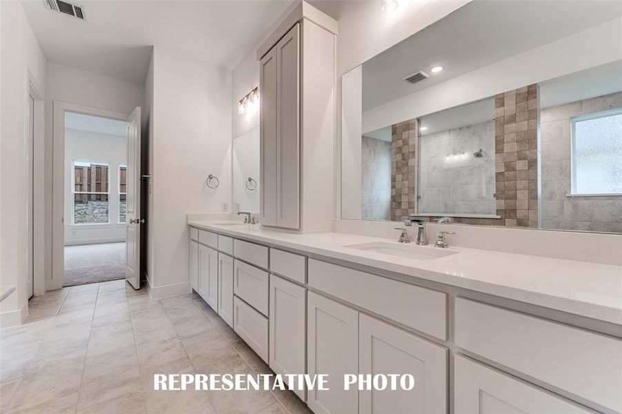 With his and her vanities, there is plenty of room for 2 in this lovely owner's bath.  REPRESENTATIVE PHOTO.