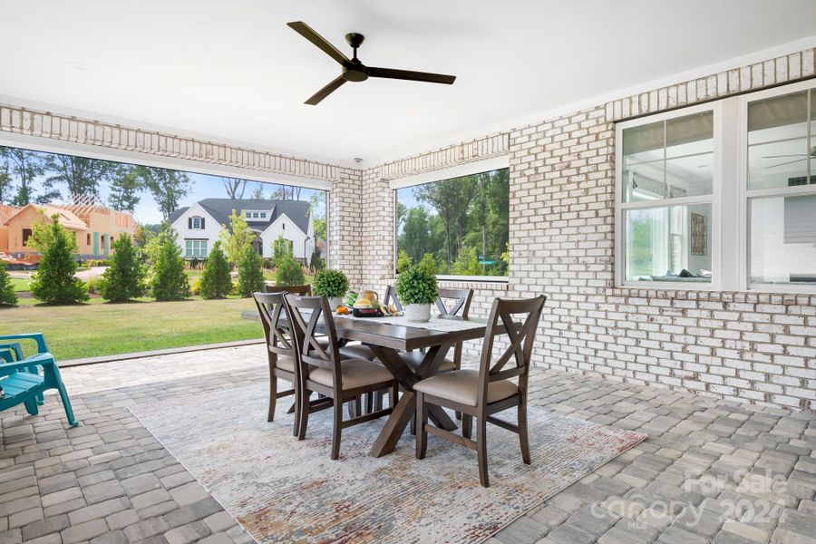 Large Covered Porch with automatic screens that raise and lower via a remote control.