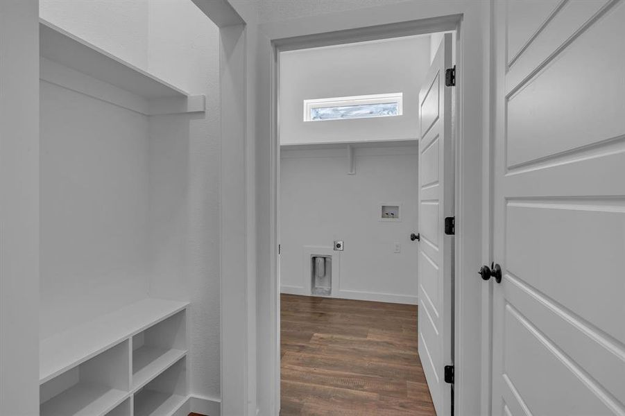 Washroom featuring hookup for an electric dryer, dark hardwood / wood-style flooring, and hookup for a washing machine