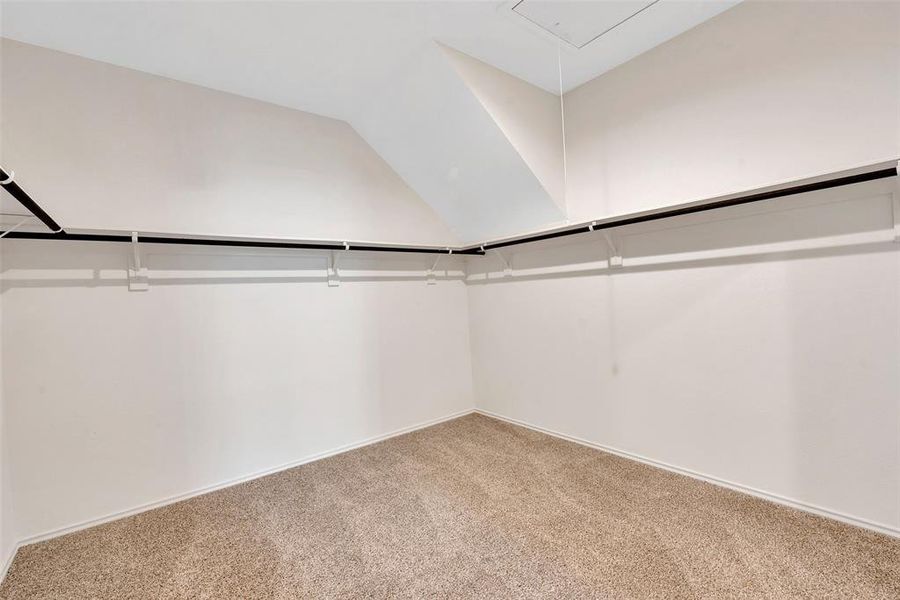 The huge closet in the primary suite has lots of storage.