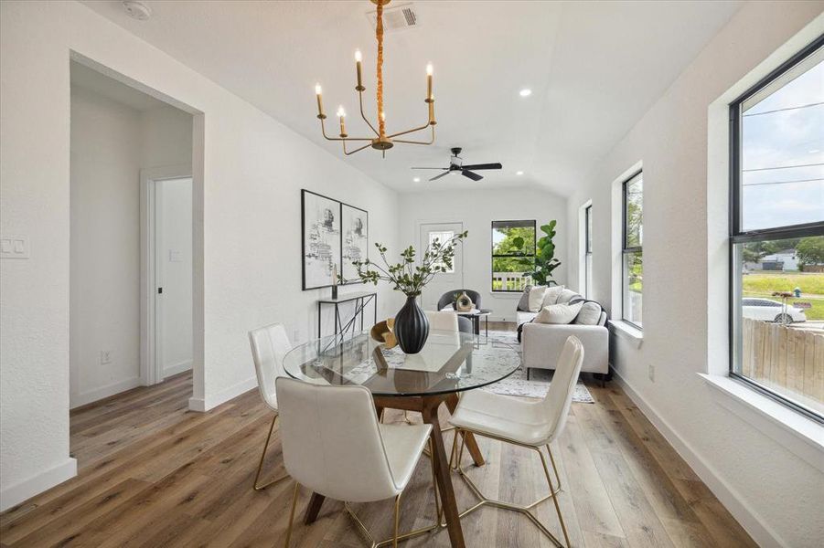 You’ll create memories of a lifetime together in this beautiful space. Enjoy good food and great conversation with friends and family in this open dining area with beautiful flooring and a stylish chandelier.