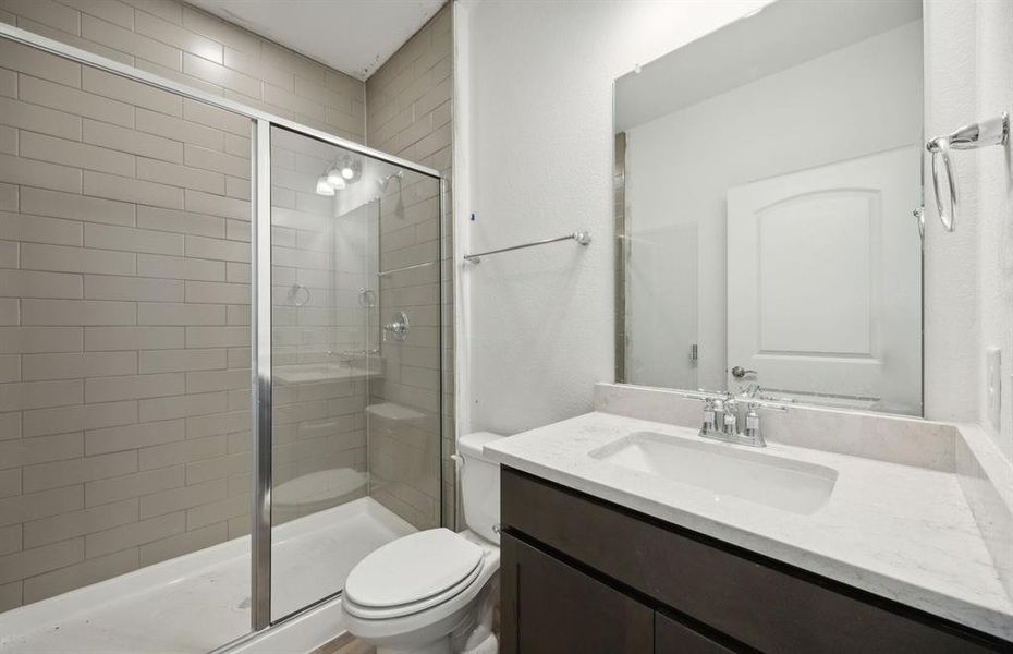 Spacious secondary bathroom with upgraded shower *real home pictured