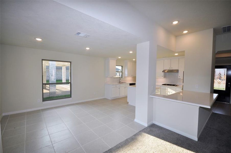 The Breakfast Room and the Kitchen are open into the family room.