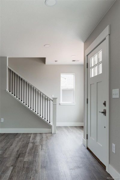 open staircase to the four upstairs bedrooms