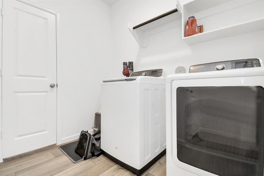 Laundry room with direct access to primary closet