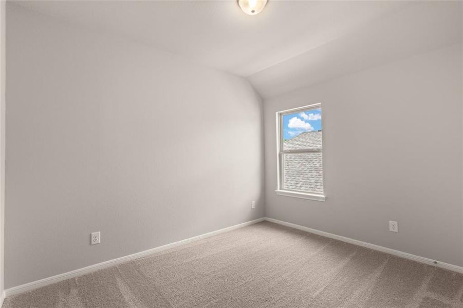 Your secondary bedroom features plush carpet, fresh paint, closet, and a large window that lets in plenty of natural lighting.