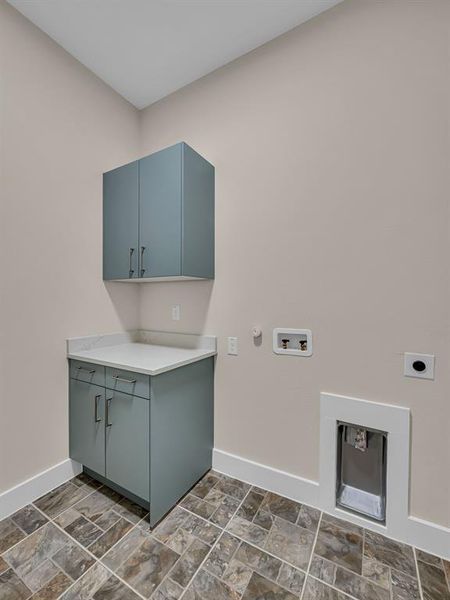 Laundry area with electric dryer hookup, washer hookup, cabinets, and gas dryer hookup